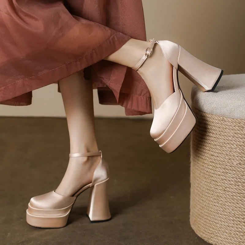 Women's white platform high heels with a chunky heel and round toe.