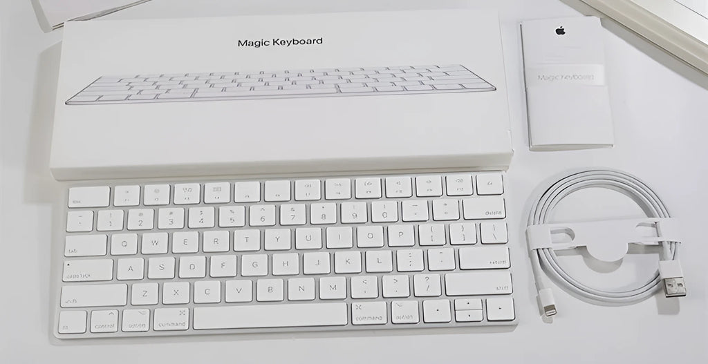 Genuine white Apple Bluetooth G6 wireless keyboard with ultra-thin metal build on a desk.