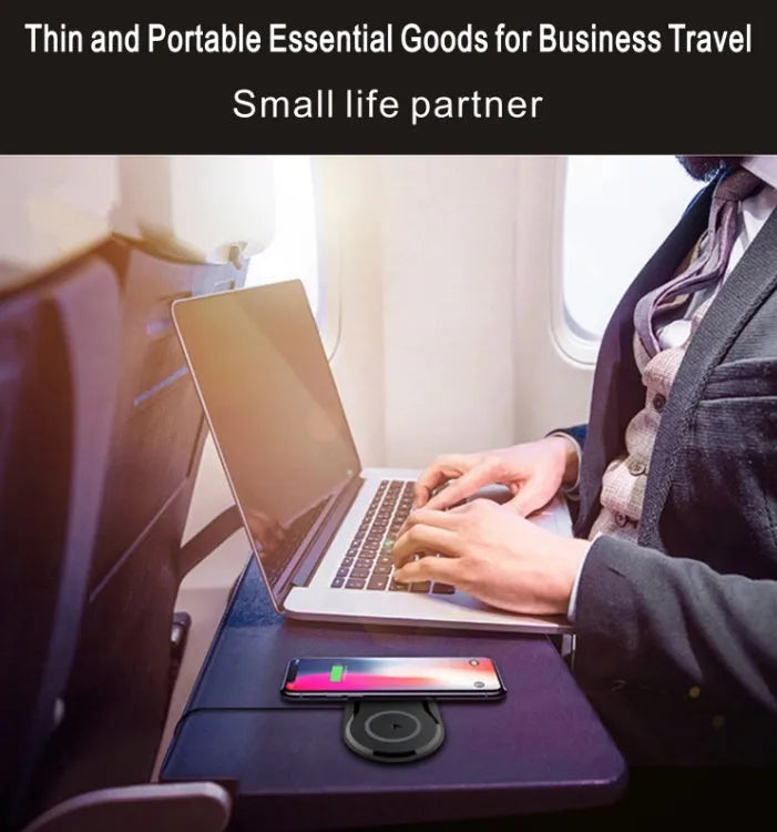Black dual wireless charging pad showing two smartphones charging simultaneously on a desk.