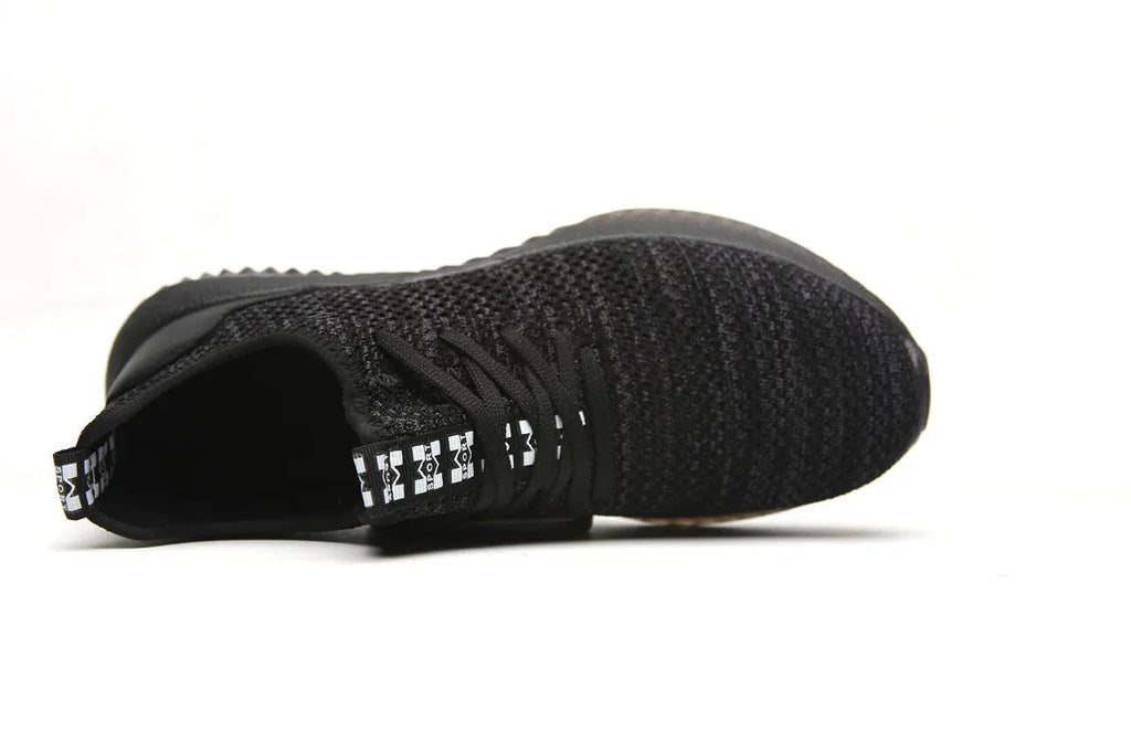 Men's black safety work shoes with steel toe cap on a grey background