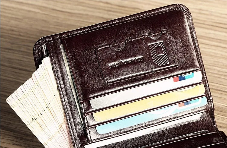 Men's black leather wallet open to show photo window, card slots, coin pocket and banknote folder.