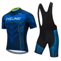 A man and woman wearing a matching blue cycling jersey and shorts set for summer road biking.