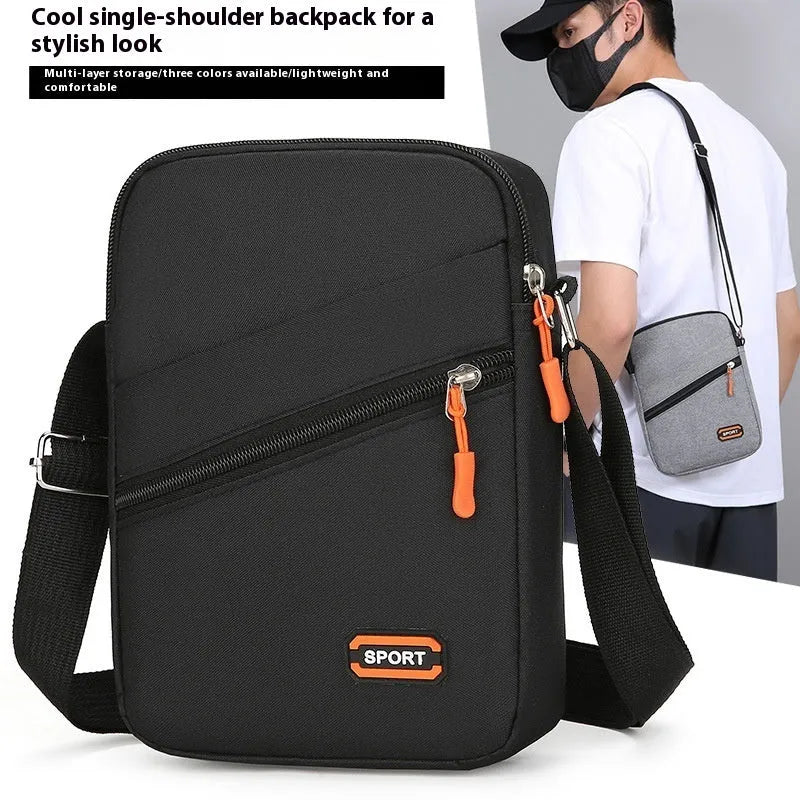 Solid colour Oxford cloth commuter bag with contrast detailing and crossbody shoulder strap