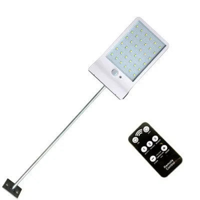Black and white outdoor solar-powered garden light with LED illumination for pathways.