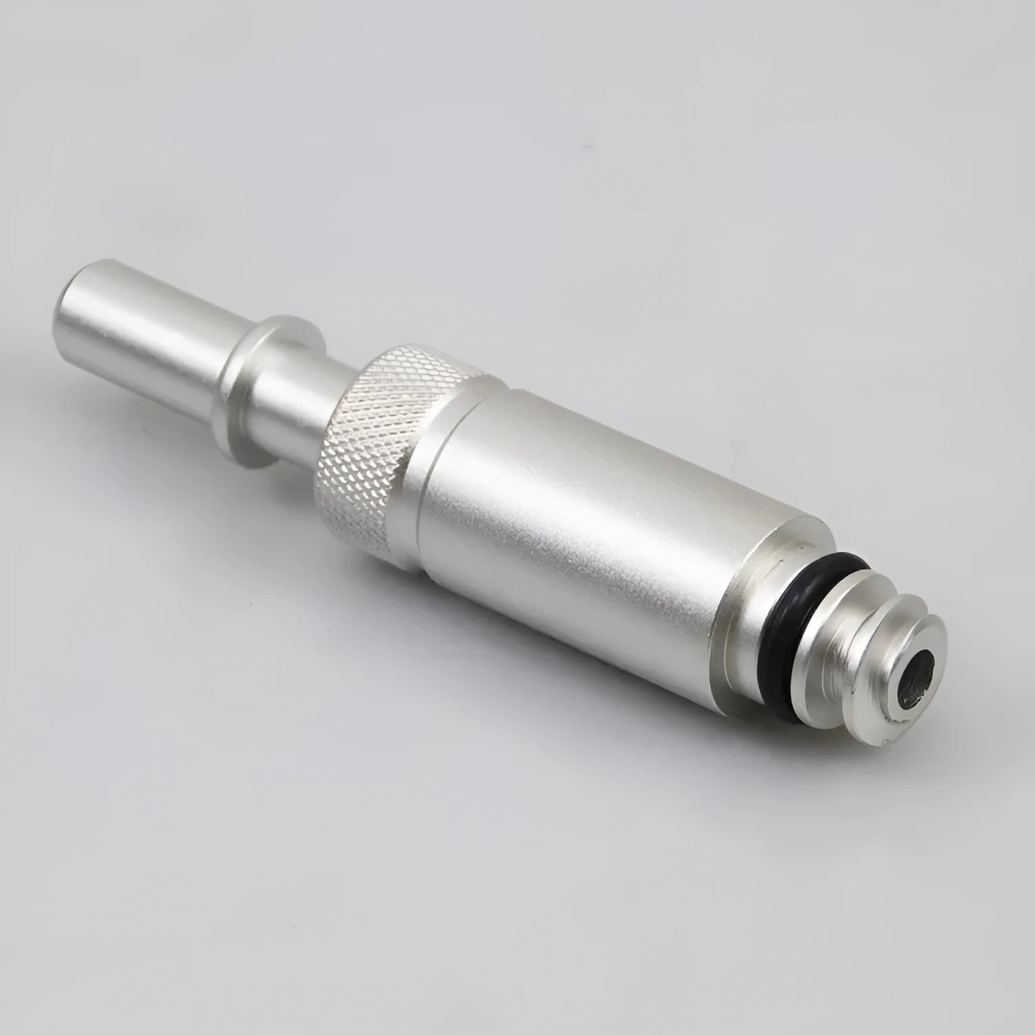 Silver metal VAS6262-9 transmission refuelling joint tool on a workshop bench.