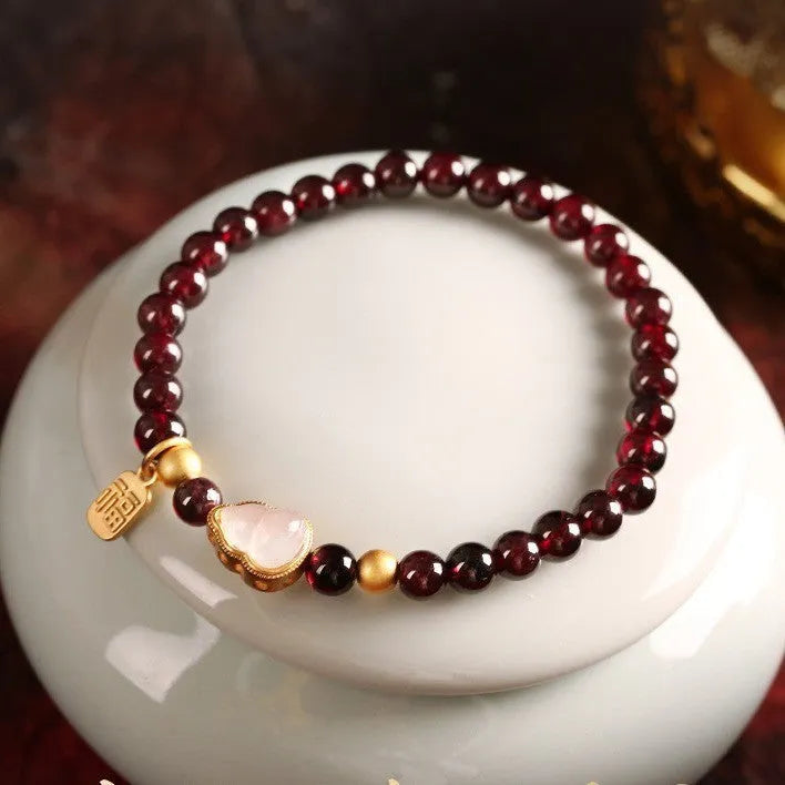 Chinese-style women's gourd bracelet with imitation garnet beads and Fu character.