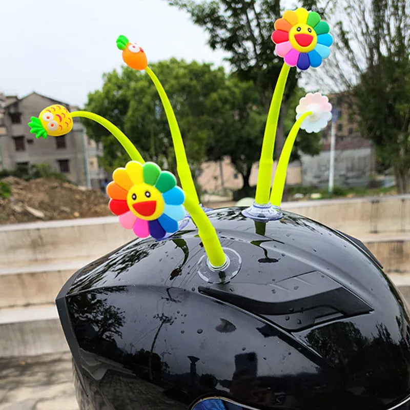 Yellow silicone sunflower helmet decoration with suction cup mount on a motorcycle helmet