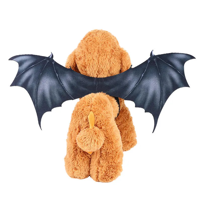 Black cloth bat wing costume accessory for a dog or cat on a Halloween background.