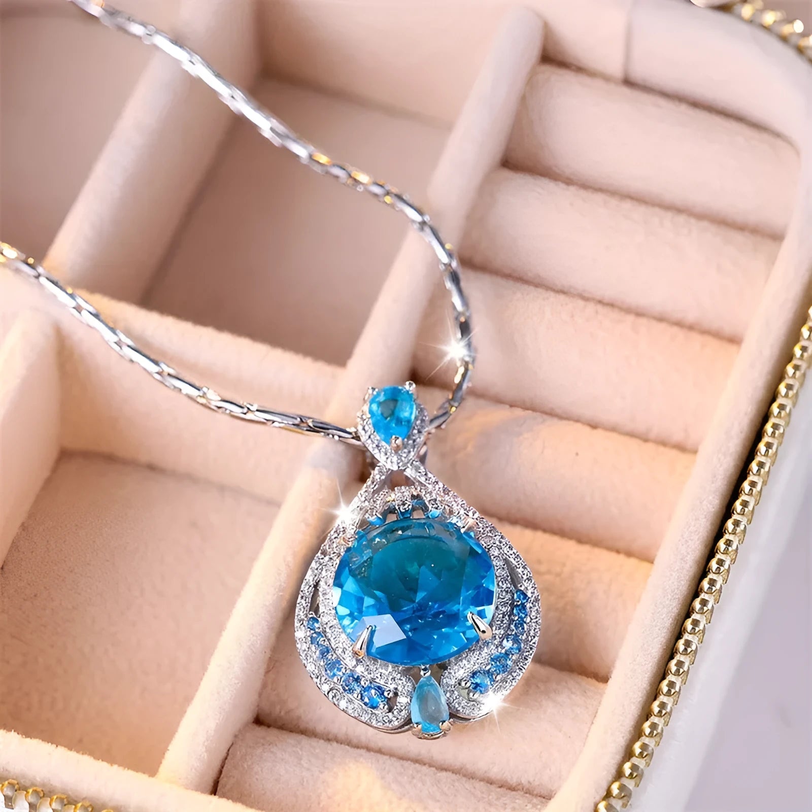 Blue crystal pendant necklace with geometric shape on water wave chain