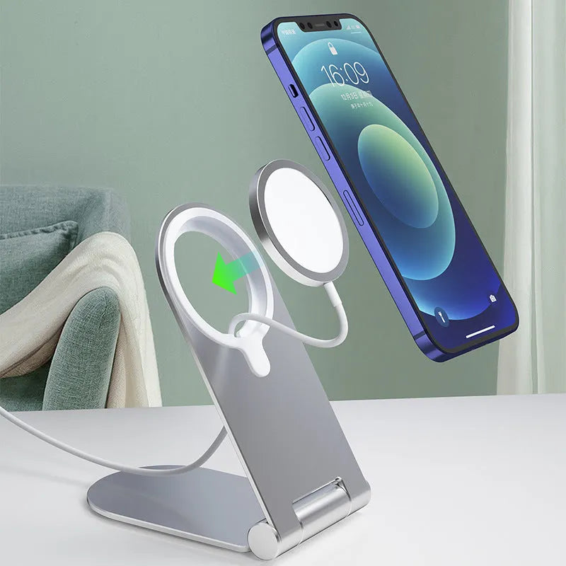Silver vertical adjustable magnetic phone bracket for iPhone 12 shown in a car and on a desk.