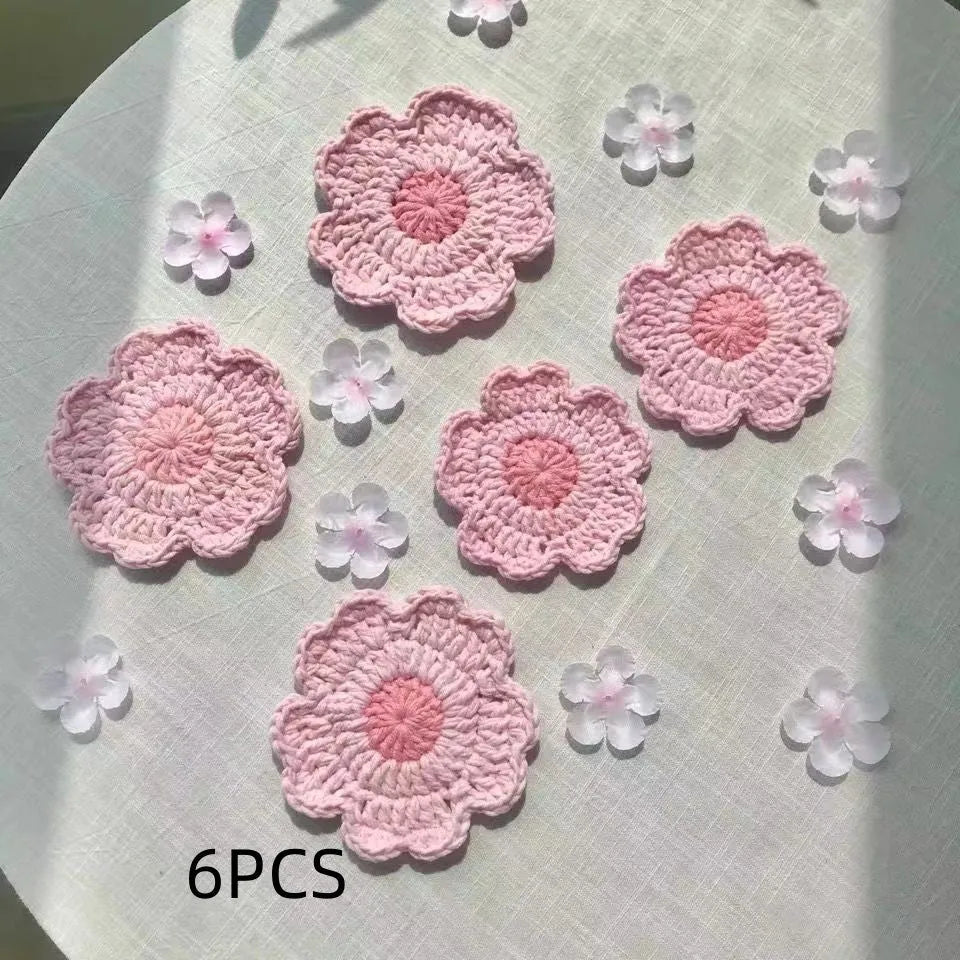 Circular handwoven wool coaster on a wooden table