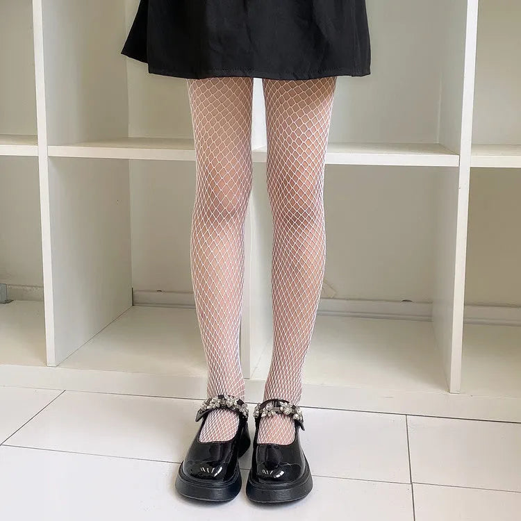 Women's summer mesh stockings showing large, medium and small pattern variations in black and white colours