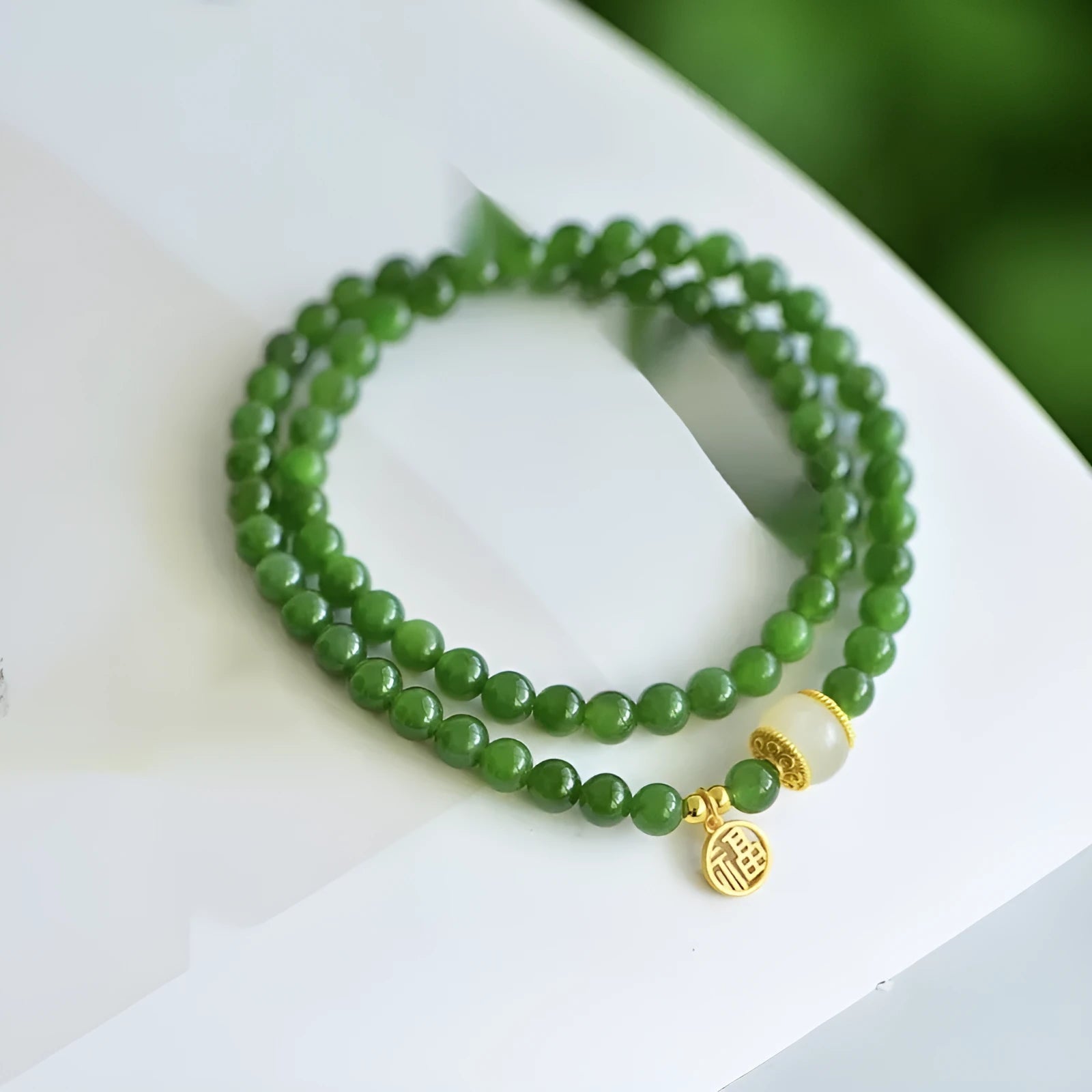 Women's double circle Hetian jade bracelet with engraved fu character in geometric design