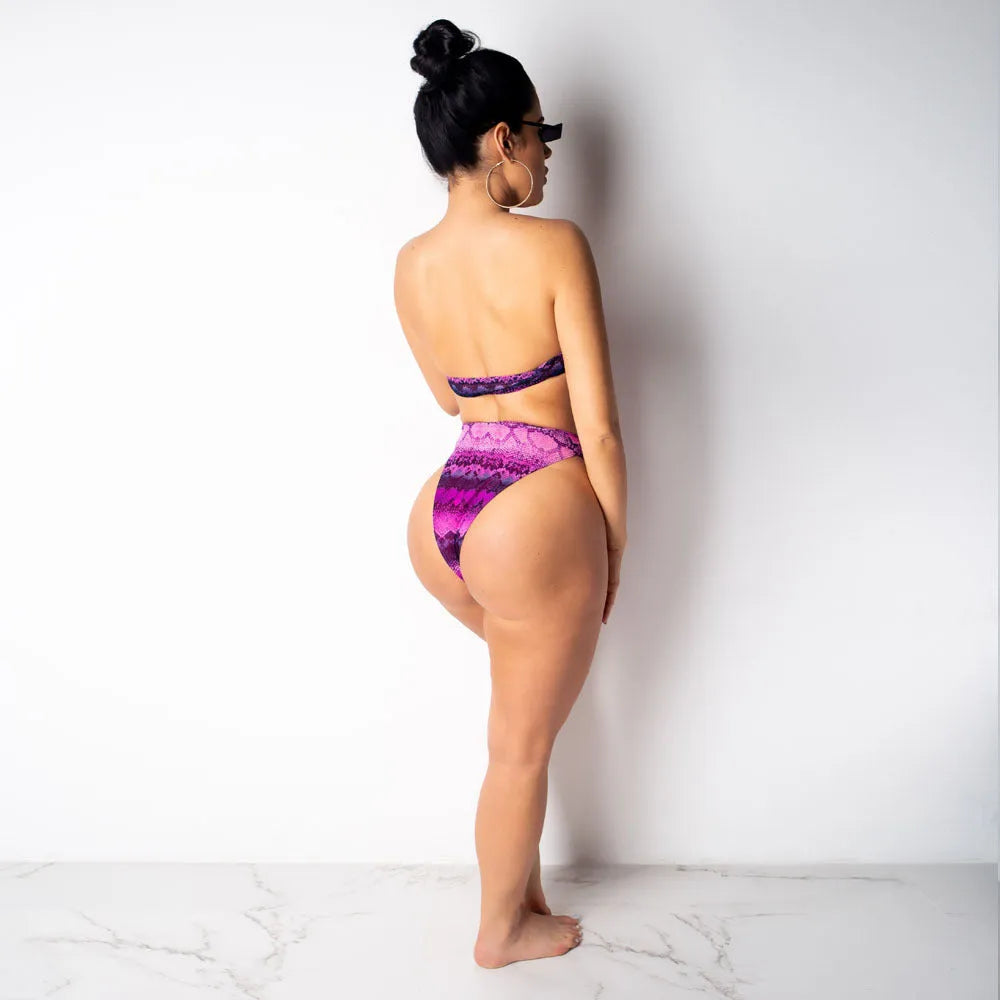 Women's snakeskin print polyester three-piece bikini suit showing long sleeve top, shorts and matching bottoms