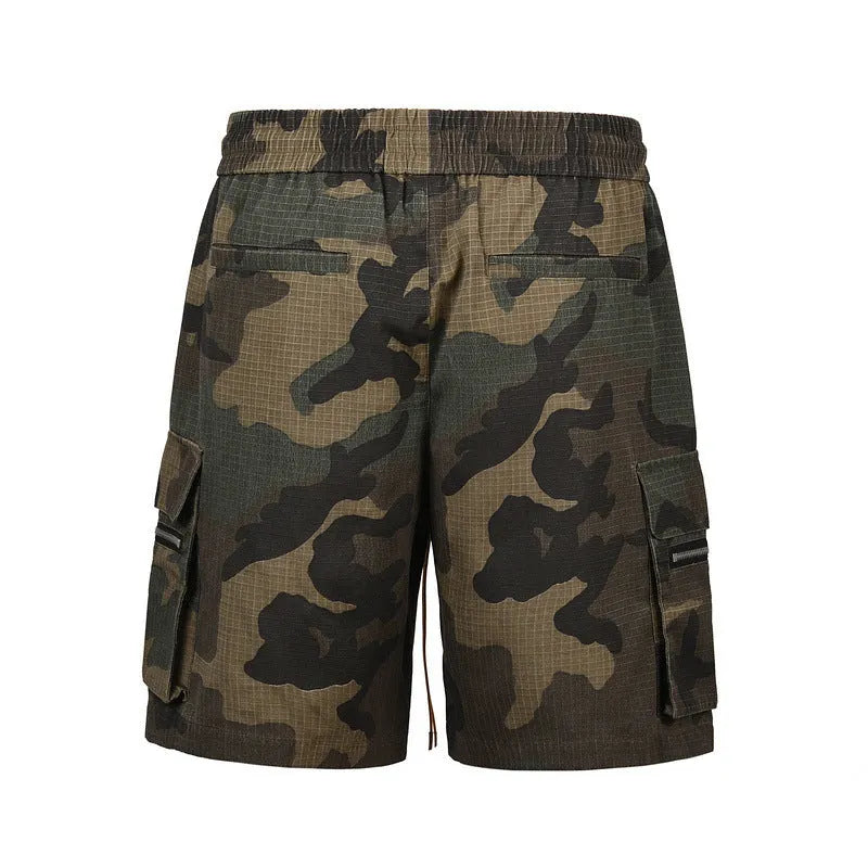 Men's green multi-bag washed camouflage cotton shorts with a loose fit on a mid-waist.