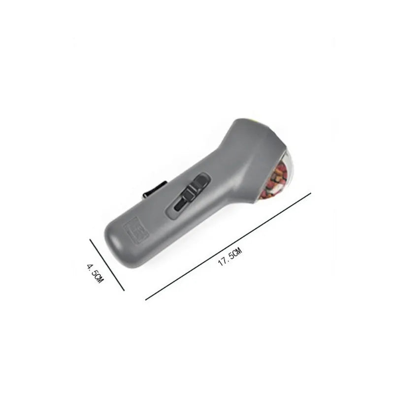 Grey pet snack catapult launcher measuring 18x7.5x3.5cm for treat ejection up to 3 metres