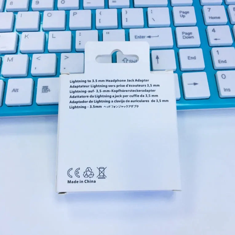 White Lightning to 3.5mm audio adapter for iPhone 7 and compatible models.