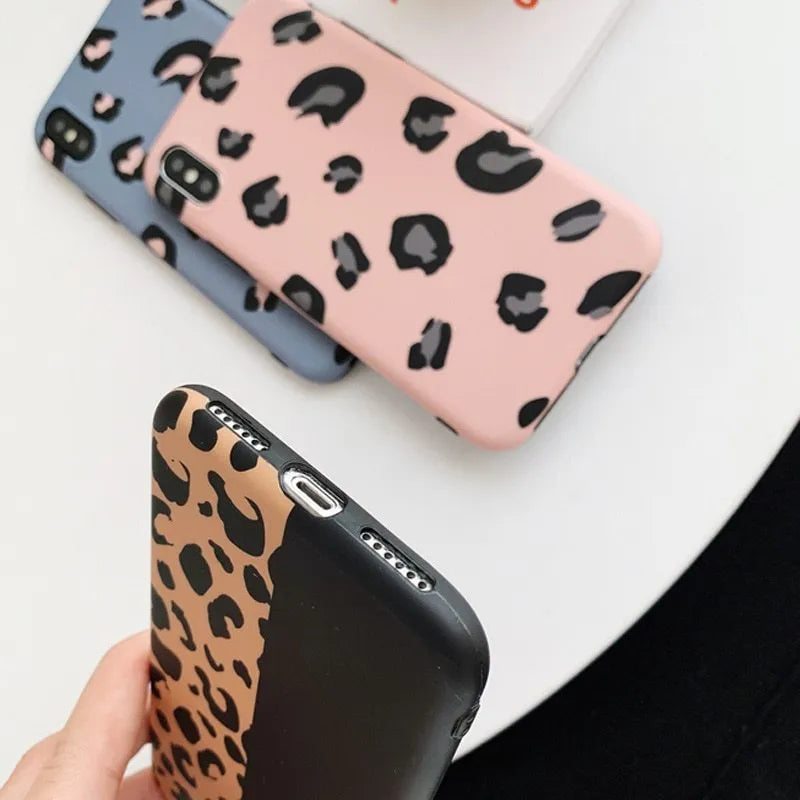 Leopard print iPhone case in black, blue, and pink colours for multiple iPhone models.
