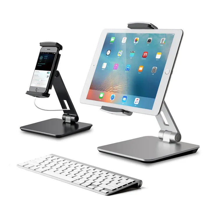 Folding aluminium phone and tablet stand in silver, shown holding a tablet at an angle.