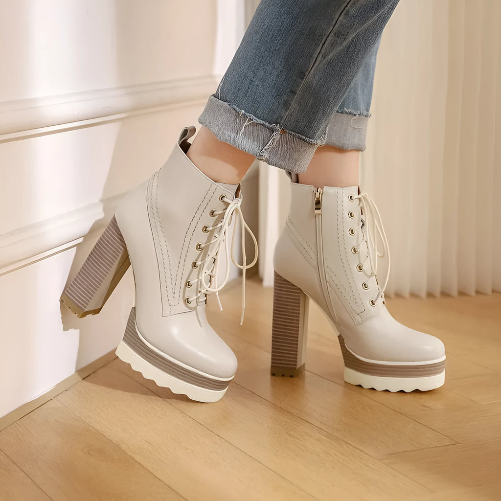 Women's black chunky heel waterproof ankle boots with a side zipper and round toe.