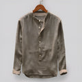 Solid colour men's casual cotton shirt on a hanger, shown in dark blue.