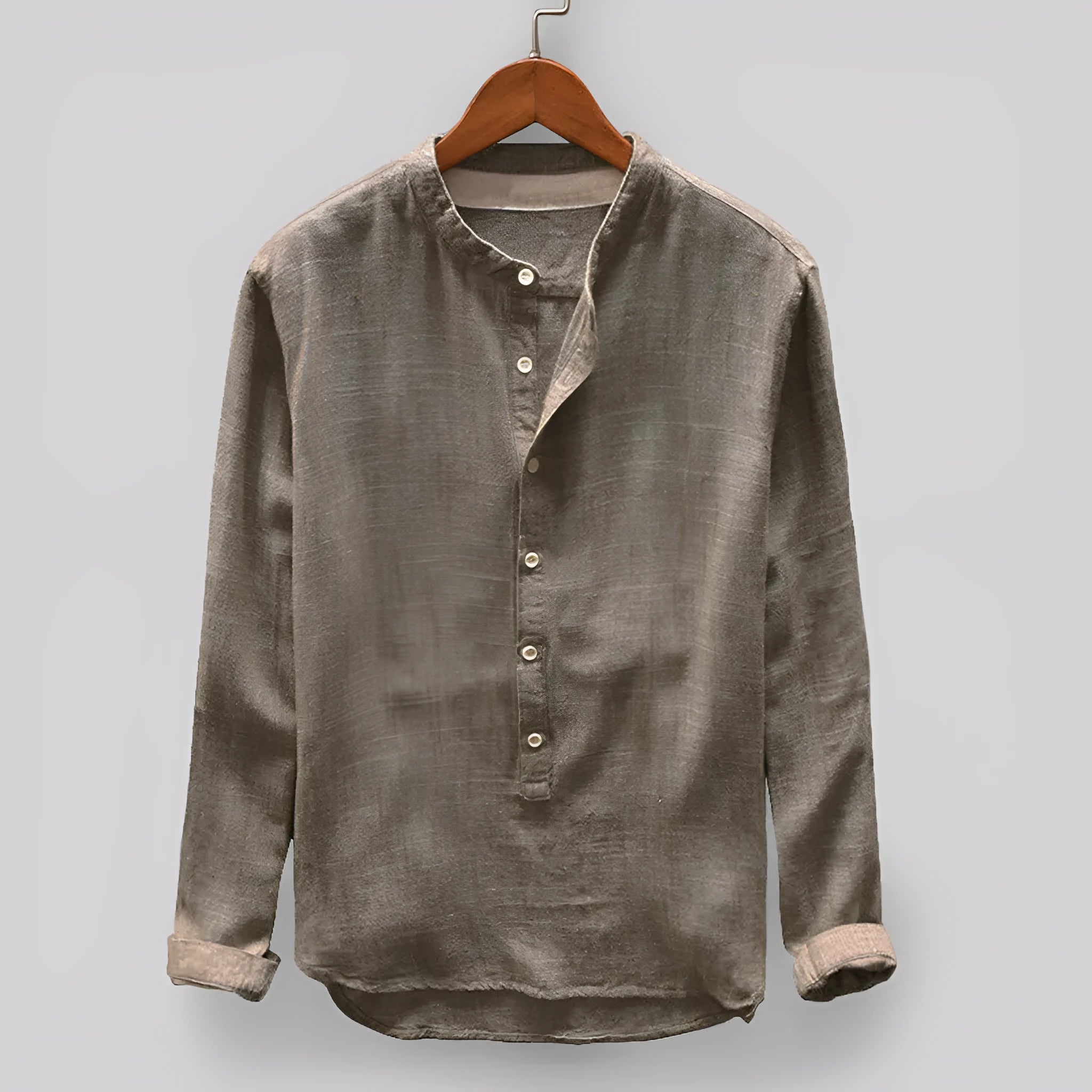 Solid colour men's casual cotton shirt on a hanger, shown in dark blue.