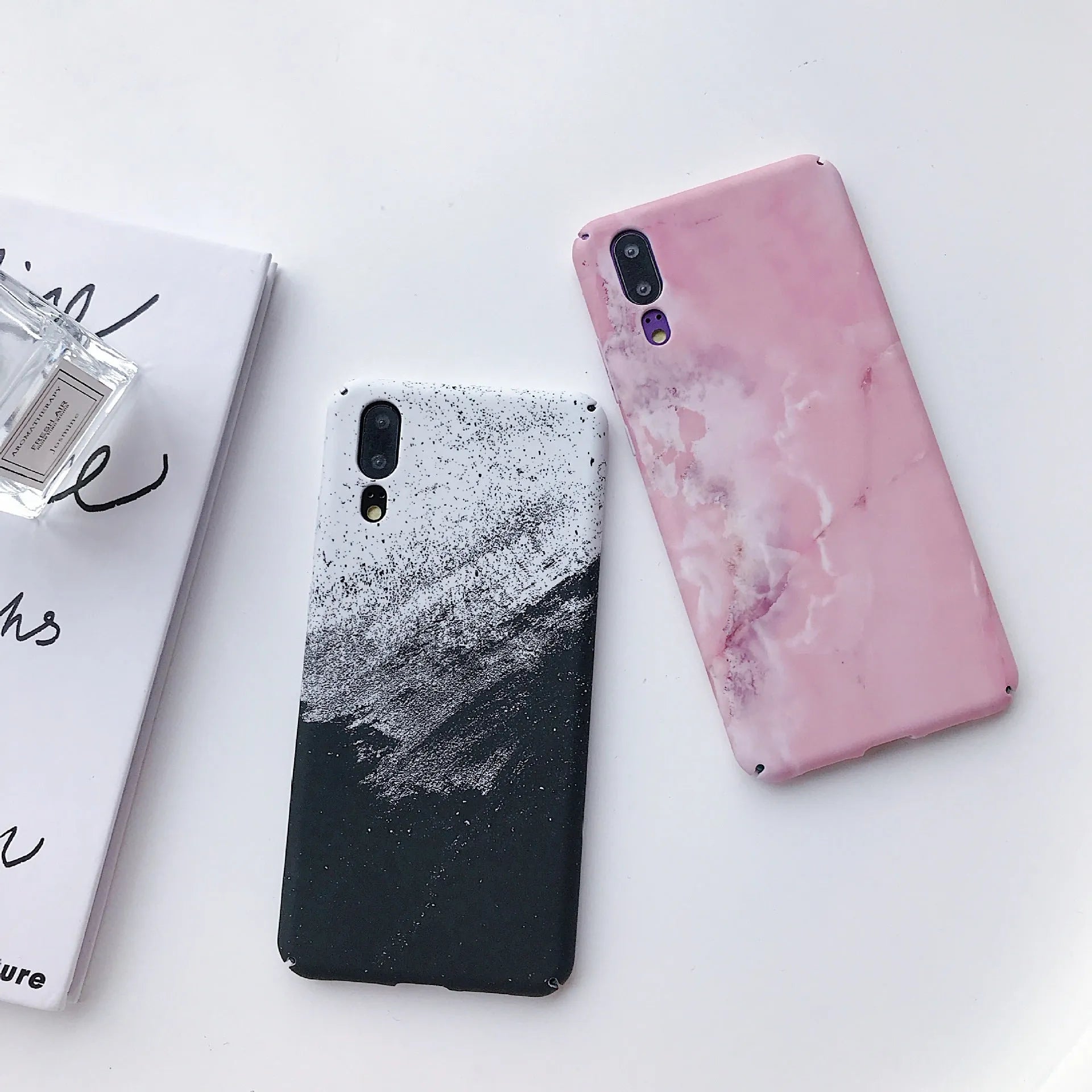 Black painted polycarbonate back cover case for a Huawei smartphone on a white background.