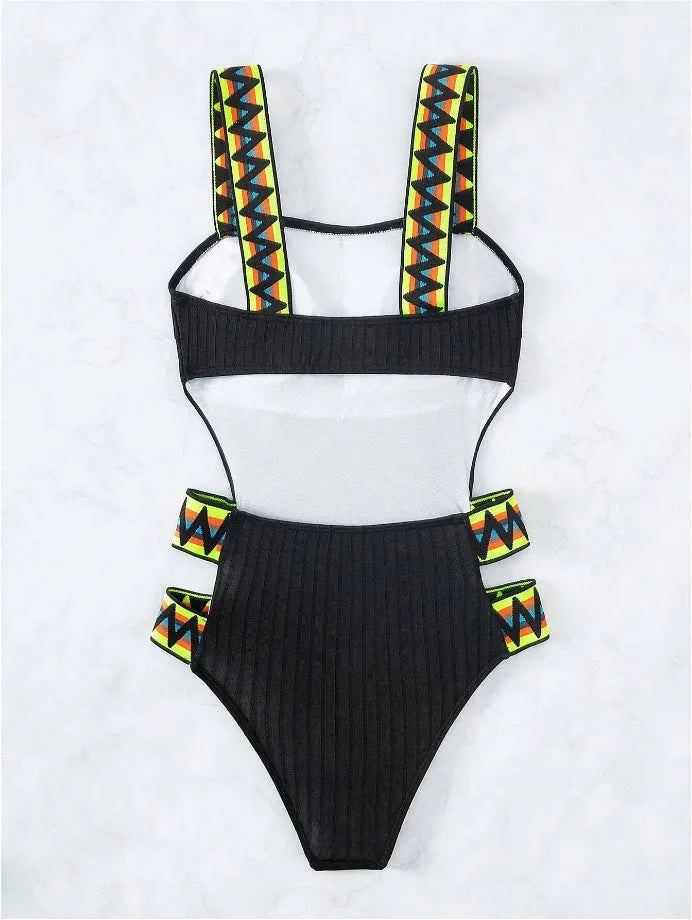 Women's solid colour one-piece swimsuit bikini in black or orange polyester.