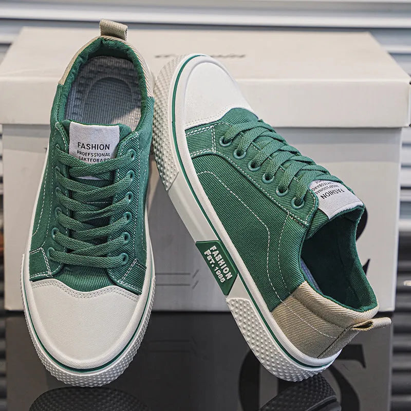 Men's low-top canvas casual shoe in blue with round toe, lace-up front, and soft PVC sole.