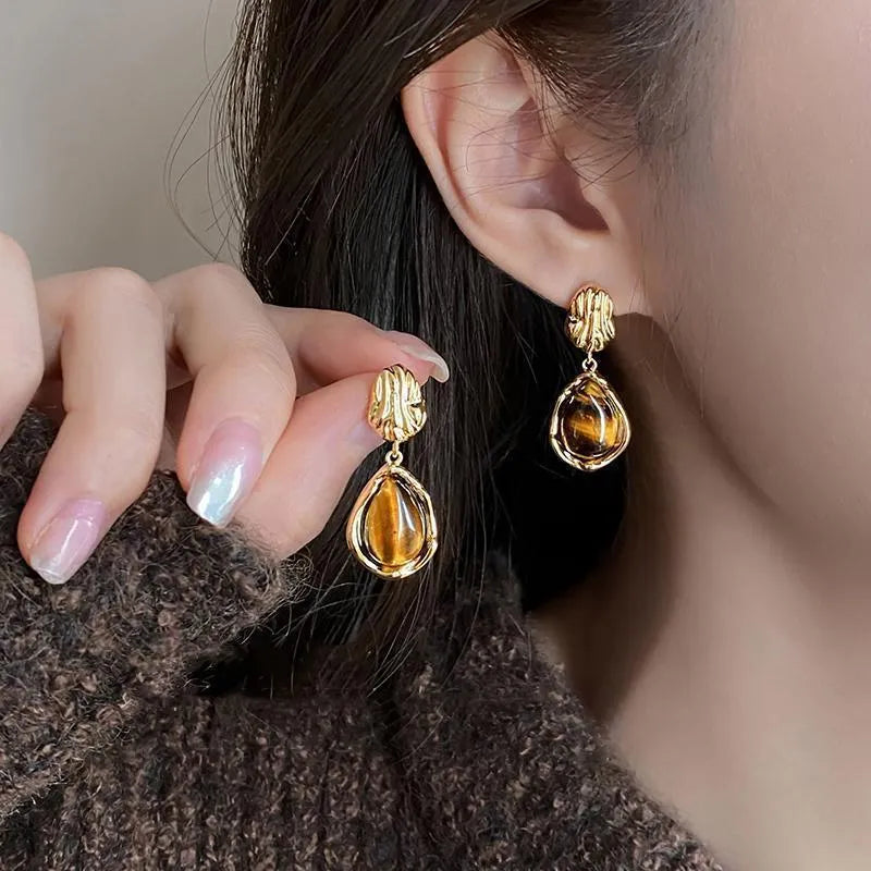 Women's geometric holiday earrings in alloy with electroplated finish and tassel elements