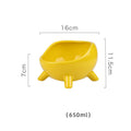 Green ceramic pet bowl with four legs and a rounded rim for stability and spill control.