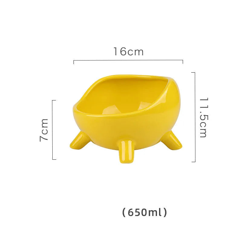 Green ceramic pet bowl with four legs and a rounded rim for stability and spill control.