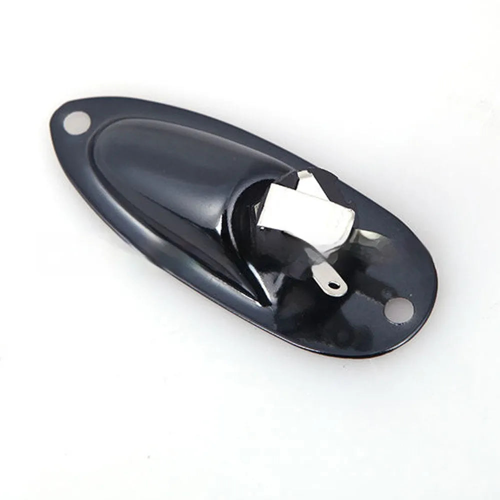 Black and silver alloy ST boat output socket for electric guitar and bass, shown next to a ruler for scale.