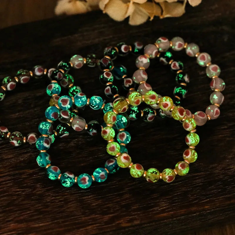 Handmade glass bracelet with swallow gold beast motifs and 10mm heart-shaped beads in multiple colour options