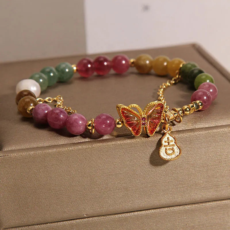 Natural jade coloured agate bracelet with a butterfly gourd design for women.