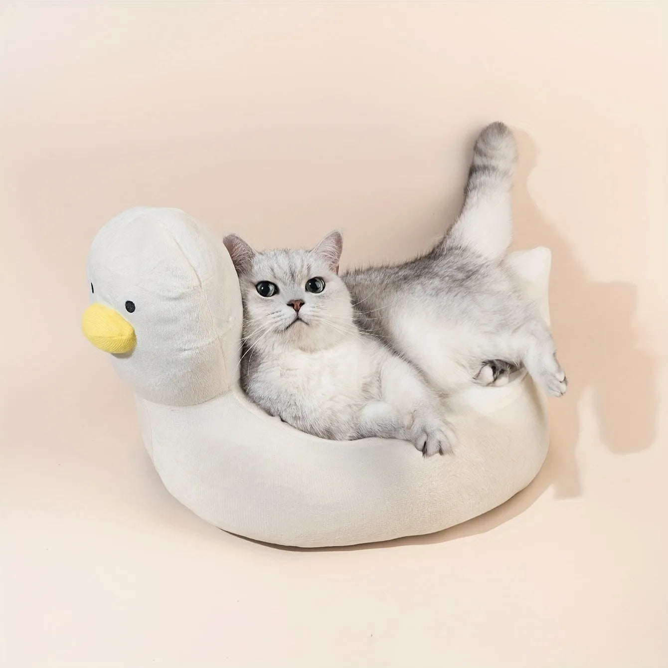 Blue duck-shaped pet bed sofa with soft polyester filling and raised edges