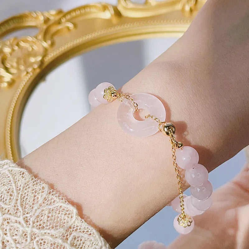 Pink crystal women's bracelet with distinctive peace buckle clasp, simple jewellery design