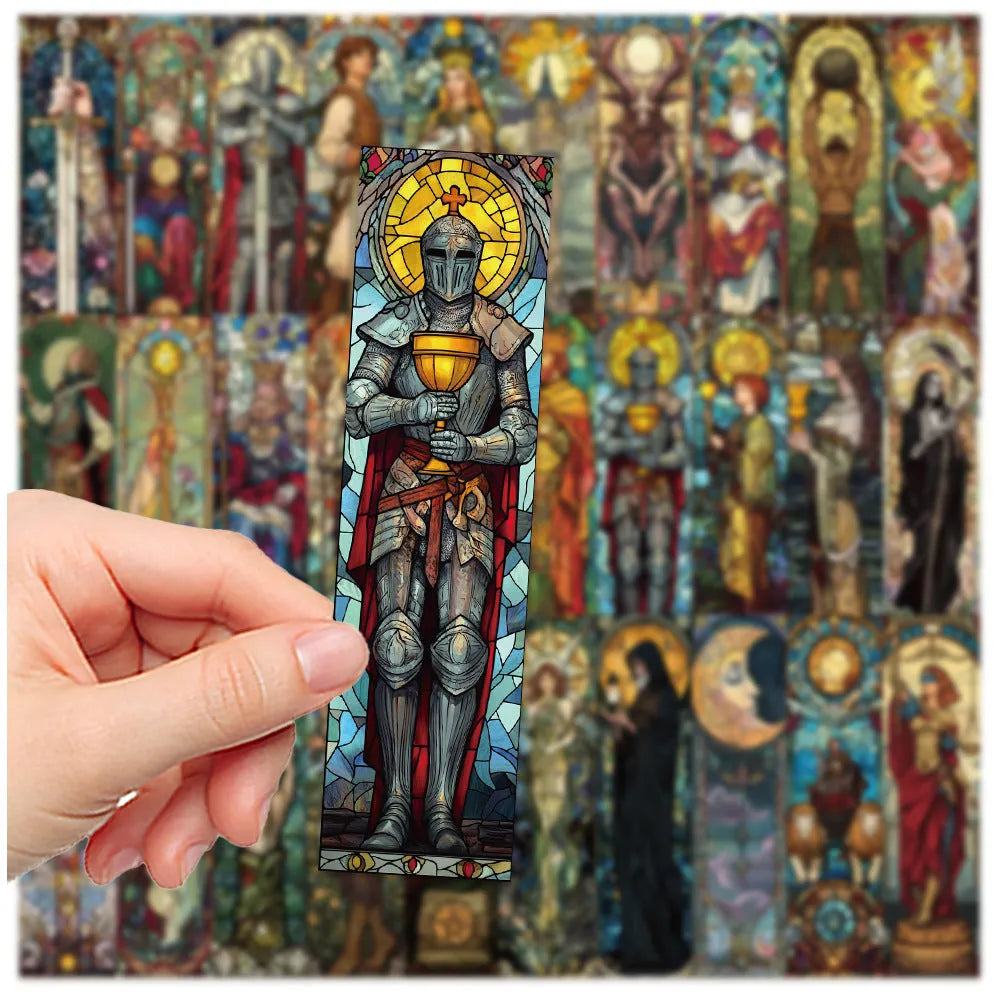 Set of 30 colourful hand-painted tarot card design paper bookmarks laid out flat.