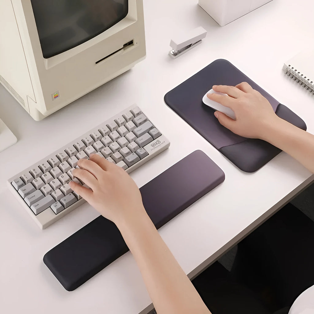Square silica gel wrist rest mouse pad with cloth top in a choice of colours on a desk.