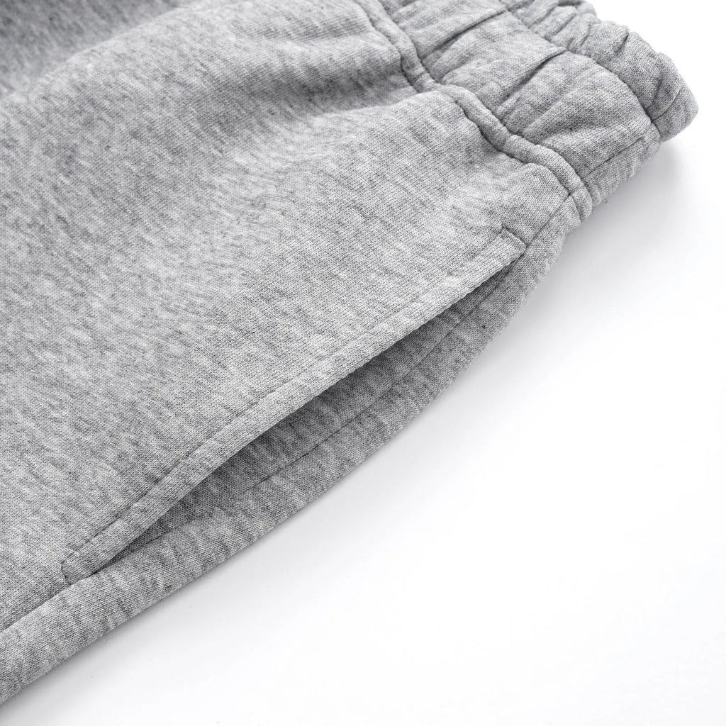 Men's solid colour cotton straight-leg casual pants in loose wide-leg fit, shown in grey.