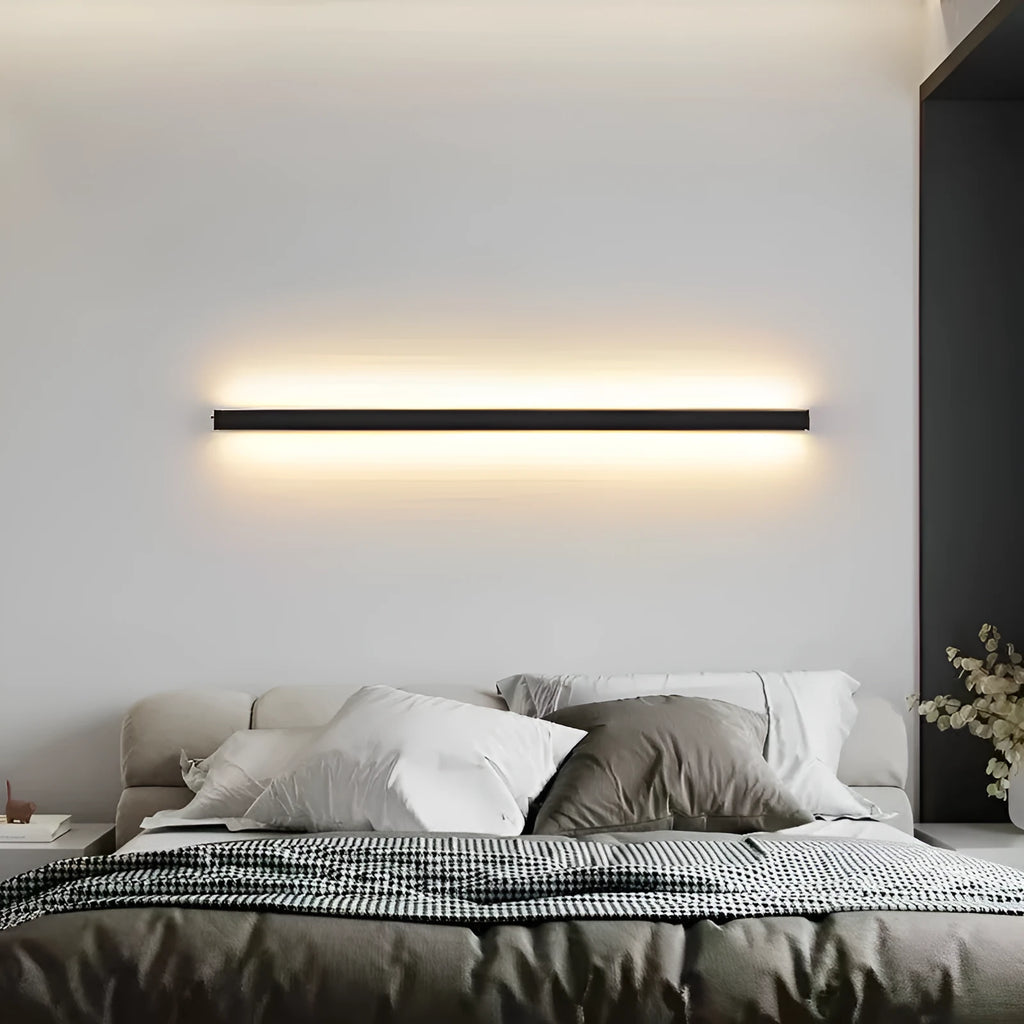 80cm long black aluminium LED strip wall lamp with a PC shade on a white wall.