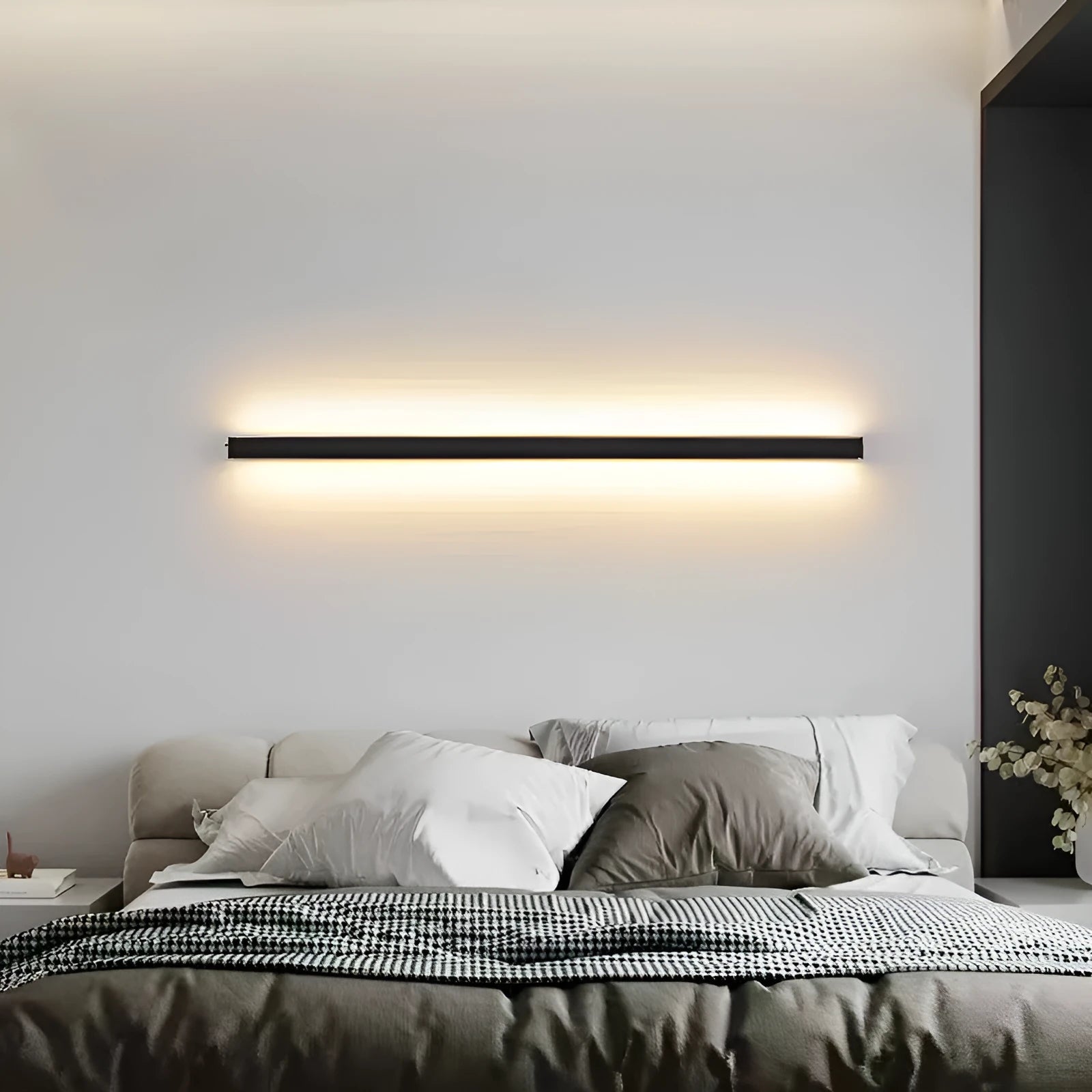 80cm long black aluminium LED strip wall lamp with a PC shade on a white wall.