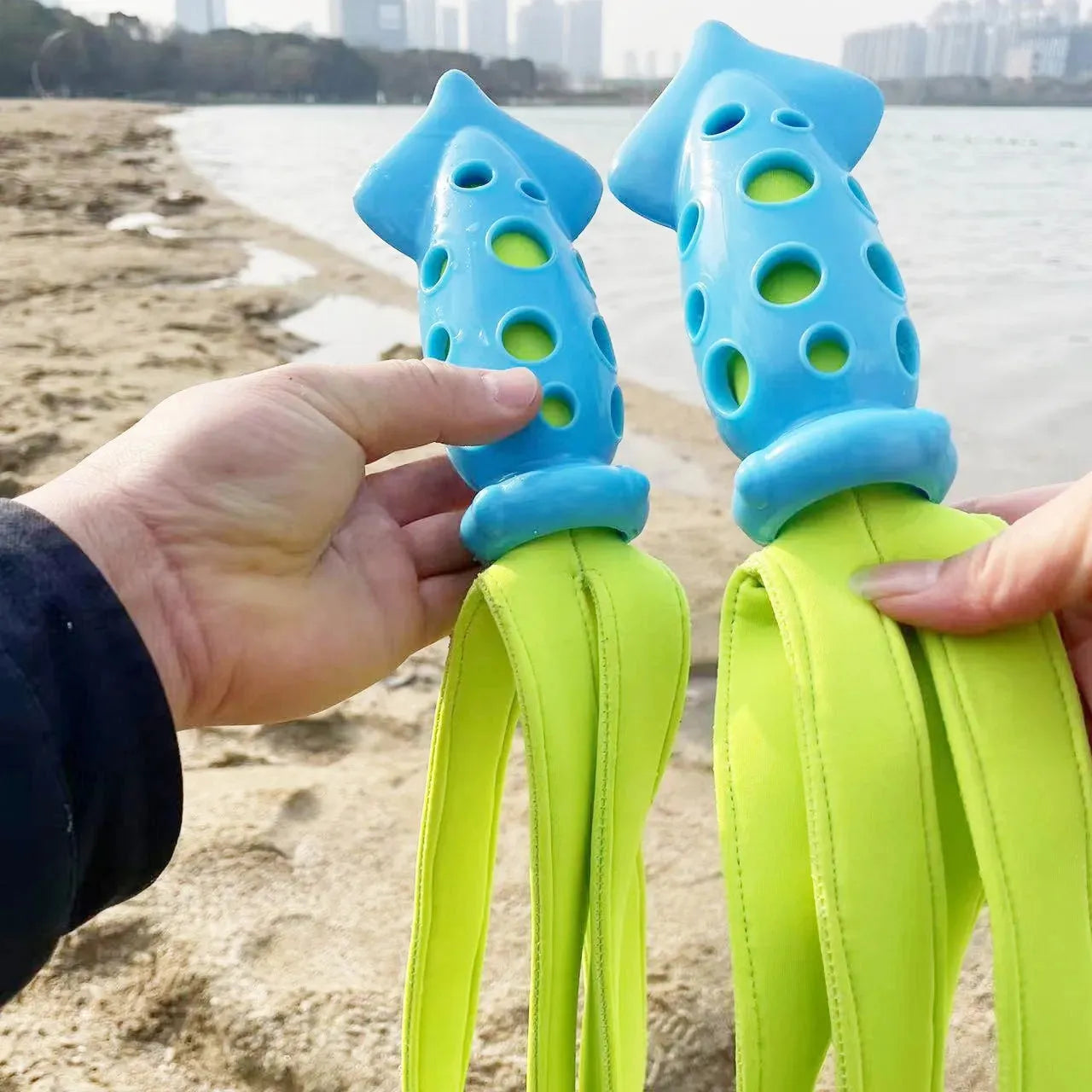 Blue cuttlefish-shaped squeaky dog chew toy, approximately 39cm long, made from rubber and cloth.