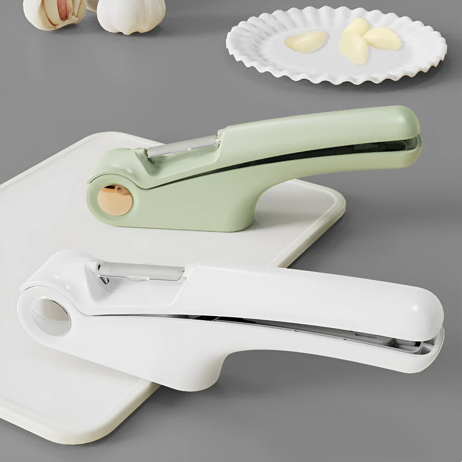 Manual garlic press kitchen tool in white colour with stainless steel components measuring 22cm