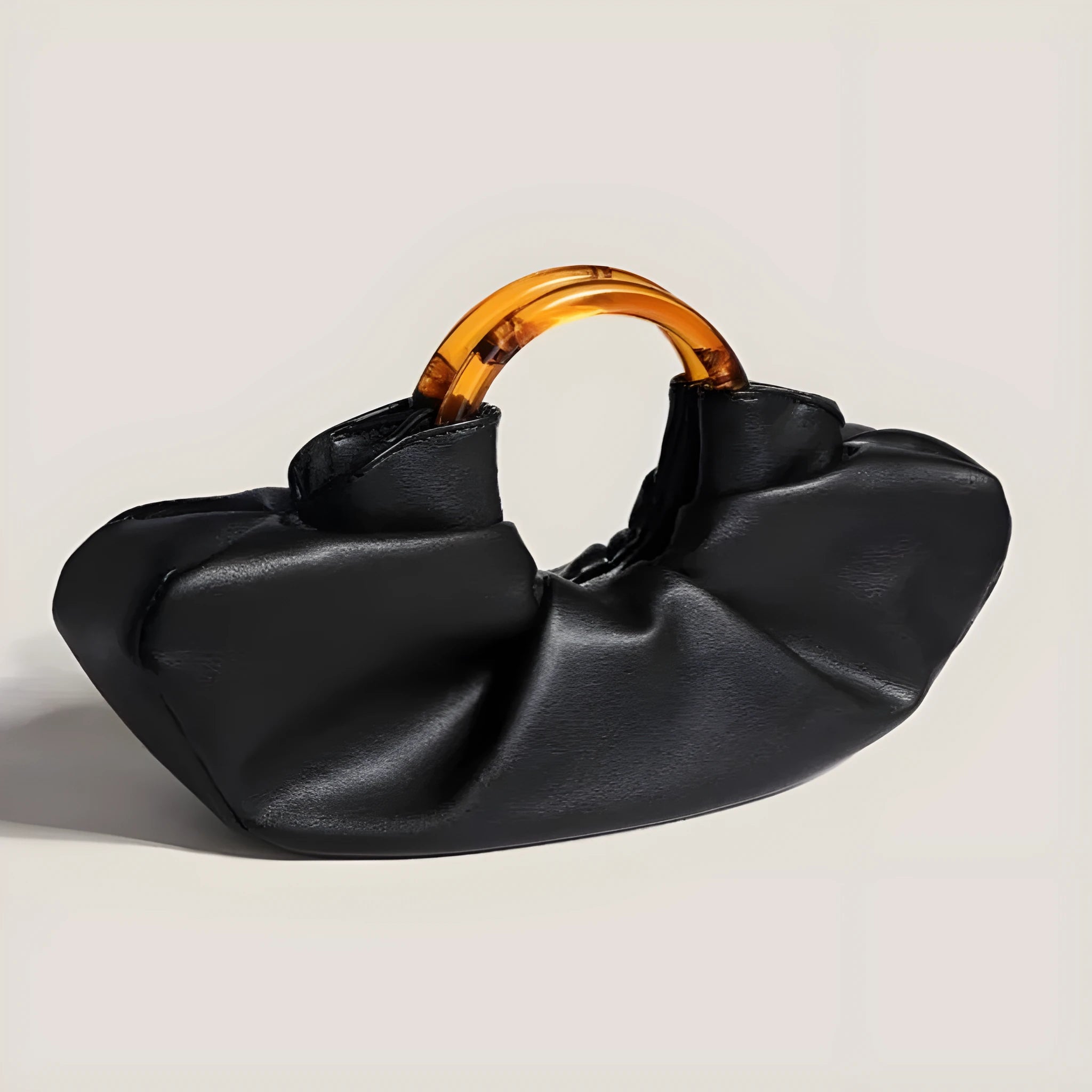 Niche Horn Bag net red acrylic ring handbag in black PU leather with fold detail