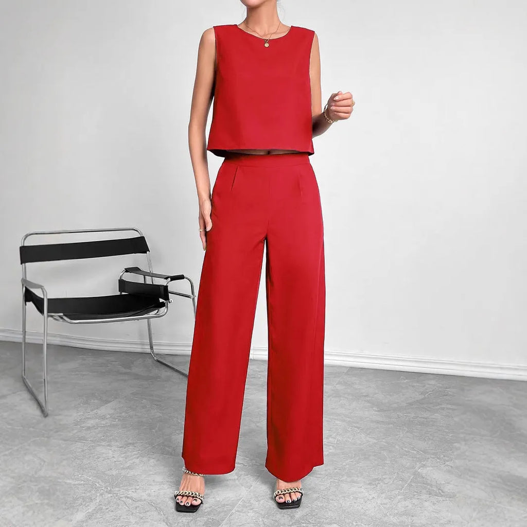 Red sleeveless top and wide leg trouser two-piece set laid flat, showing Asian sizing label.