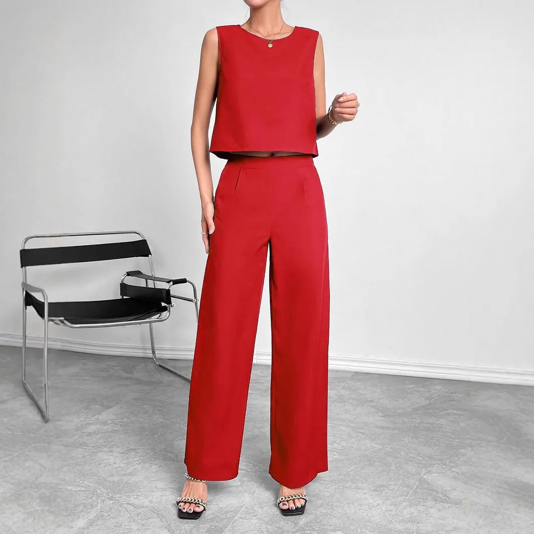 Red sleeveless top and wide leg trouser two-piece set laid flat, showing Asian sizing label.