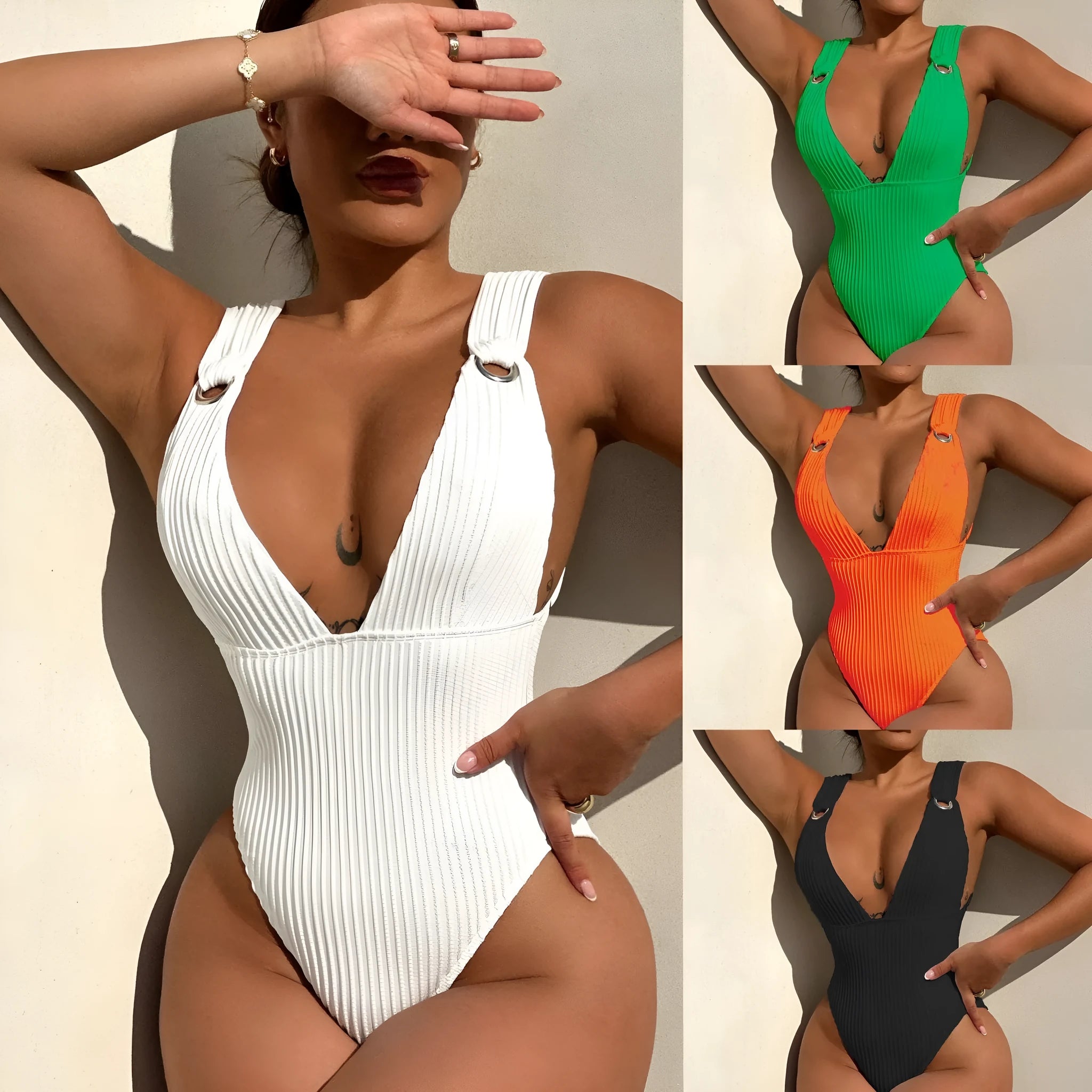 Women's solid colour one-piece swimsuit on a hanger in black, white, green, and orange.
