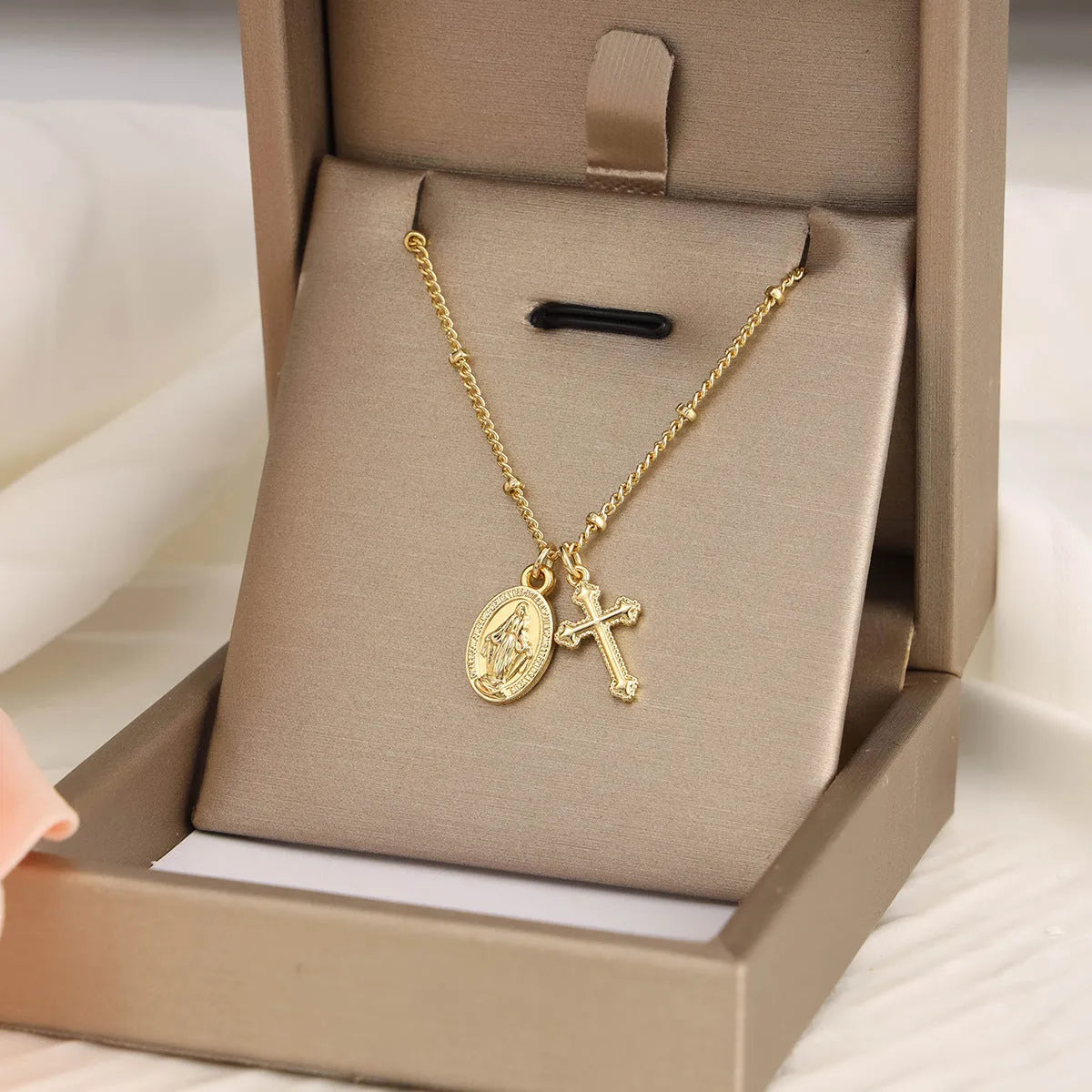 Virgin Mary cross necklace with geometric pendant in gold colour