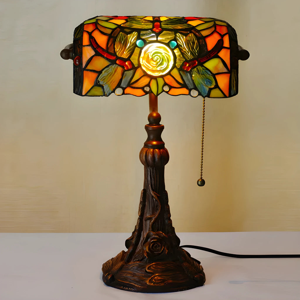 10-inch Tiffany stained glass table lamp with multicoloured glass and resin base on desk